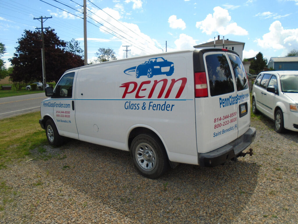 Penn Glass & Fender employee work van with logos - back side