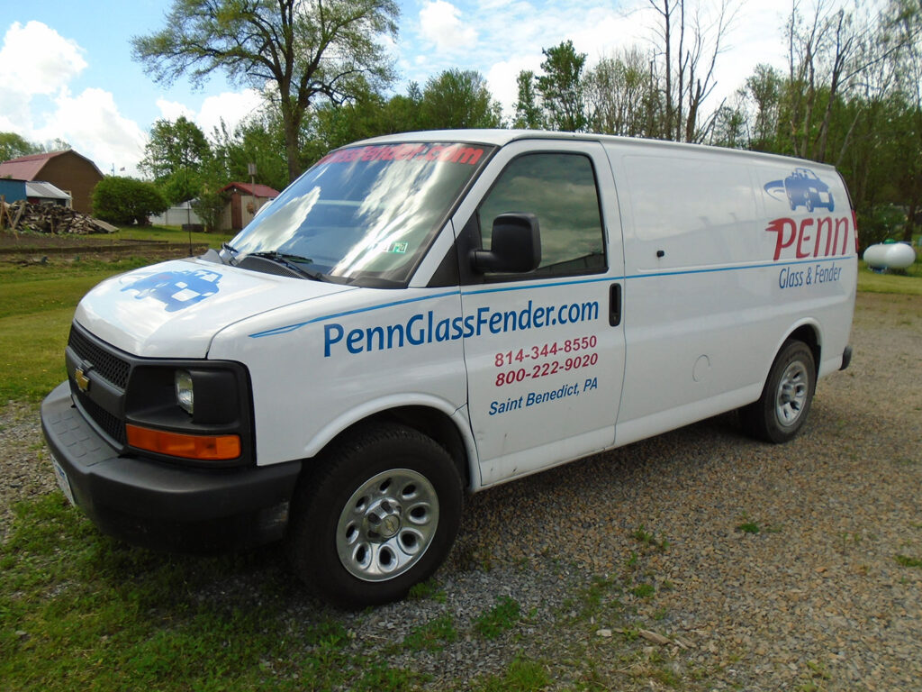 Penn Glass & Fender employee work van with logos - front side