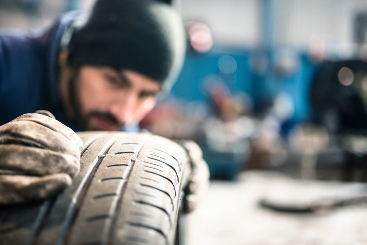 Tire repairer checking the tire integrity